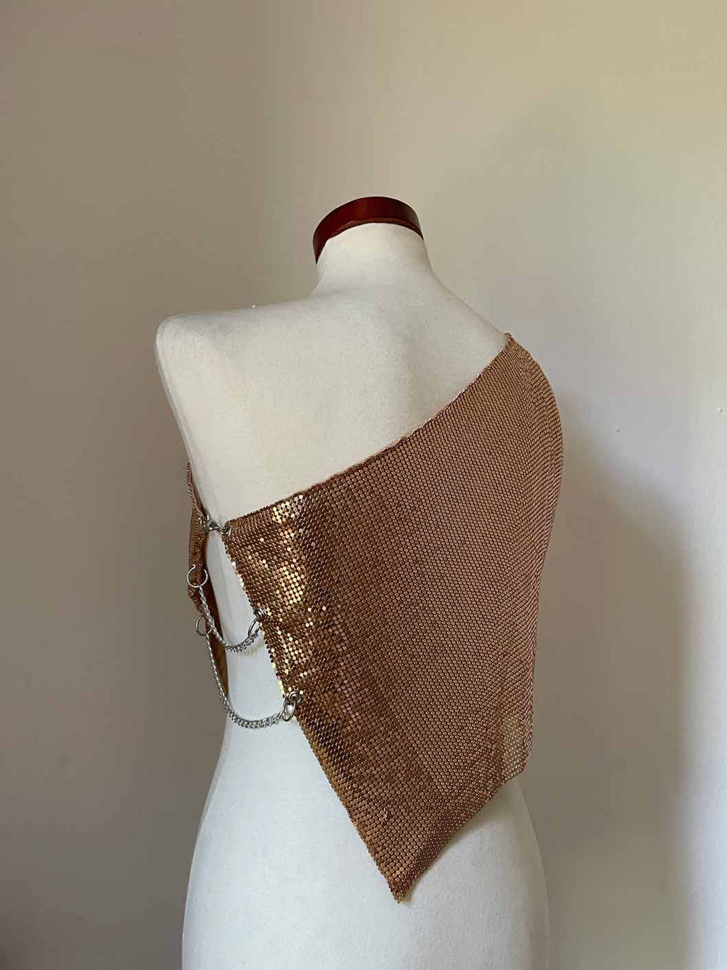 Chainmail metal mesh top in color Copper. One shoulder with silver chains on the side.